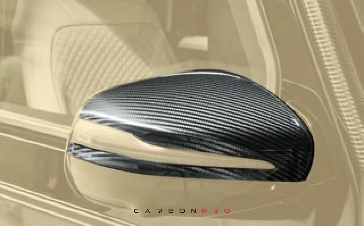 Carbon mirror housing
