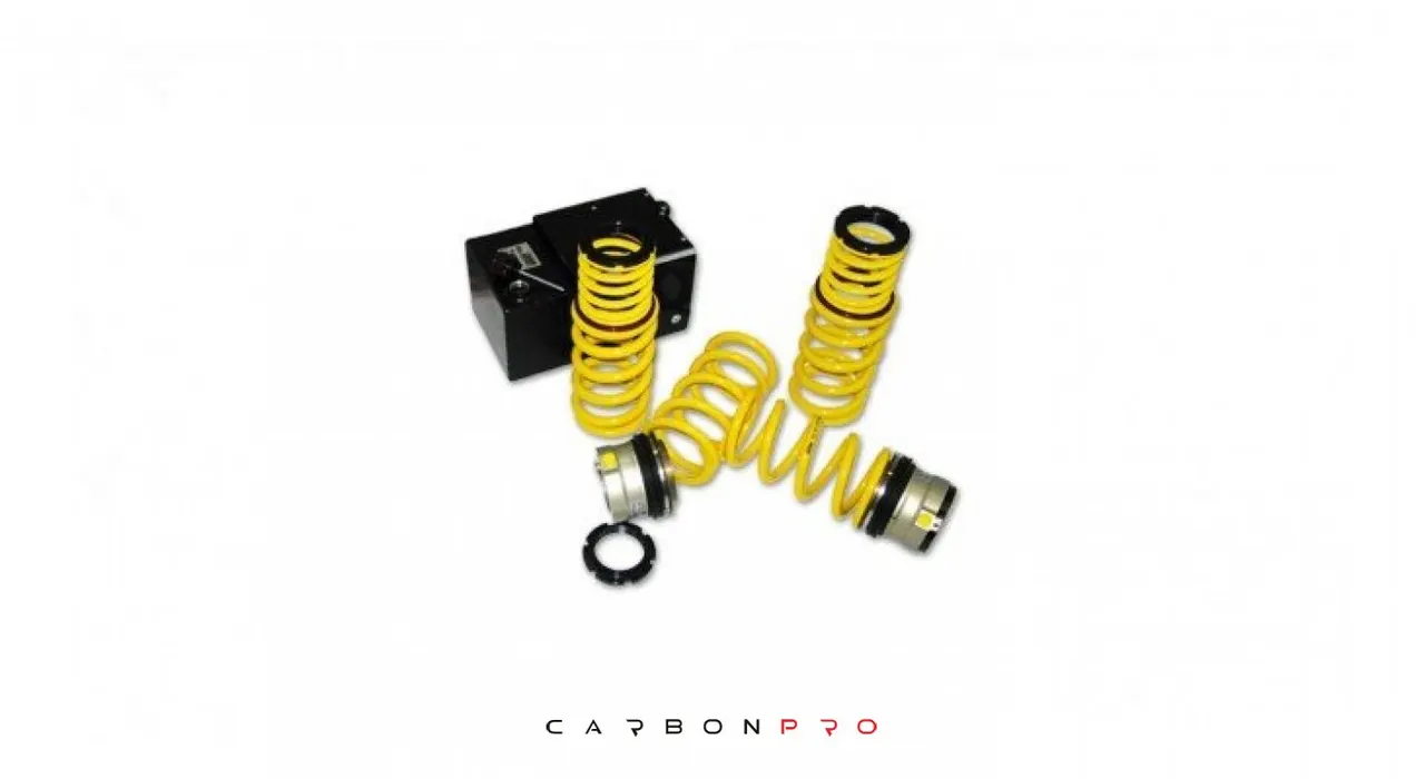 HYDRAULIC ADJUSTMENT IN COMBINATION WITH SUSPENSION SPRINGS