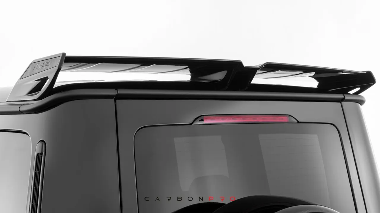 Rear spoiler with carbon inserts
