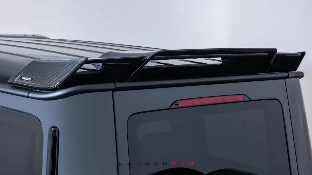 Rear spoiler with carbon inserts