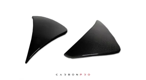 Side cover for rearbumper in visible carbon